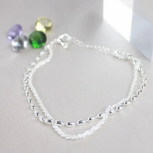 SET DI BRACCIALI IN ARGENTO CON DETTAGLI IN ZIRCONIA