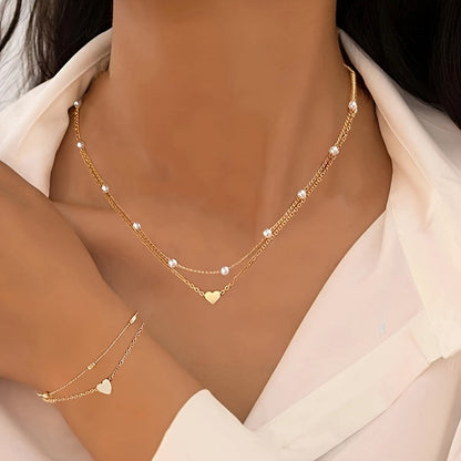SET DI GIOIELLI CON CUORE STRATIFICATO E PERLE