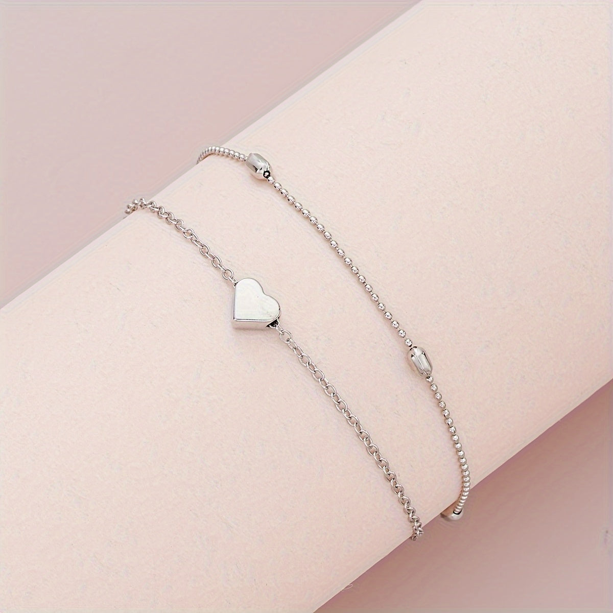 SET DI GIOIELLI CON CUORE STRATIFICATO E PERLE