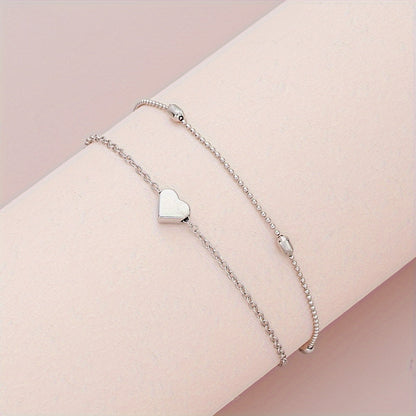 SET DI GIOIELLI CON CUORE STRATIFICATO E PERLE