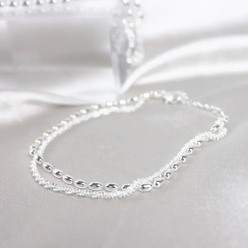 SET DI BRACCIALI IN ARGENTO CON DETTAGLI IN ZIRCONIA