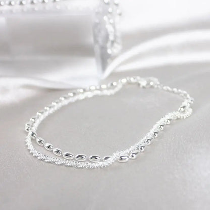 SET DI BRACCIALI IN ARGENTO CON DETTAGLI IN ZIRCONIA