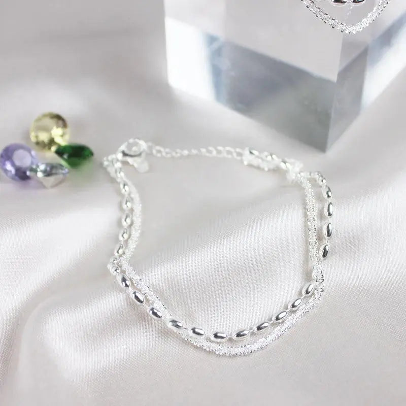 SET DI BRACCIALI IN ARGENTO CON DETTAGLI IN ZIRCONIA